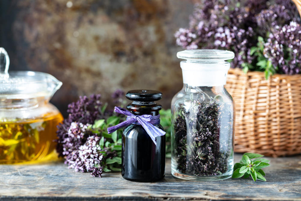 Soothing essential oils including lavender and tea tree beside a leafy poison ivy plant